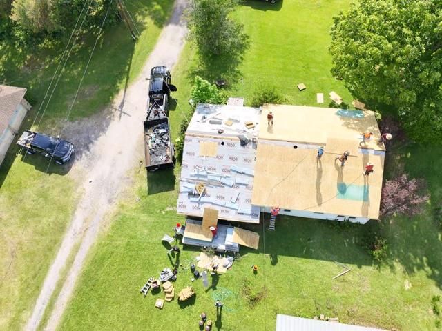 Aerial view of roof replacement in progress
